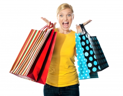 Excited woman with shopping bags